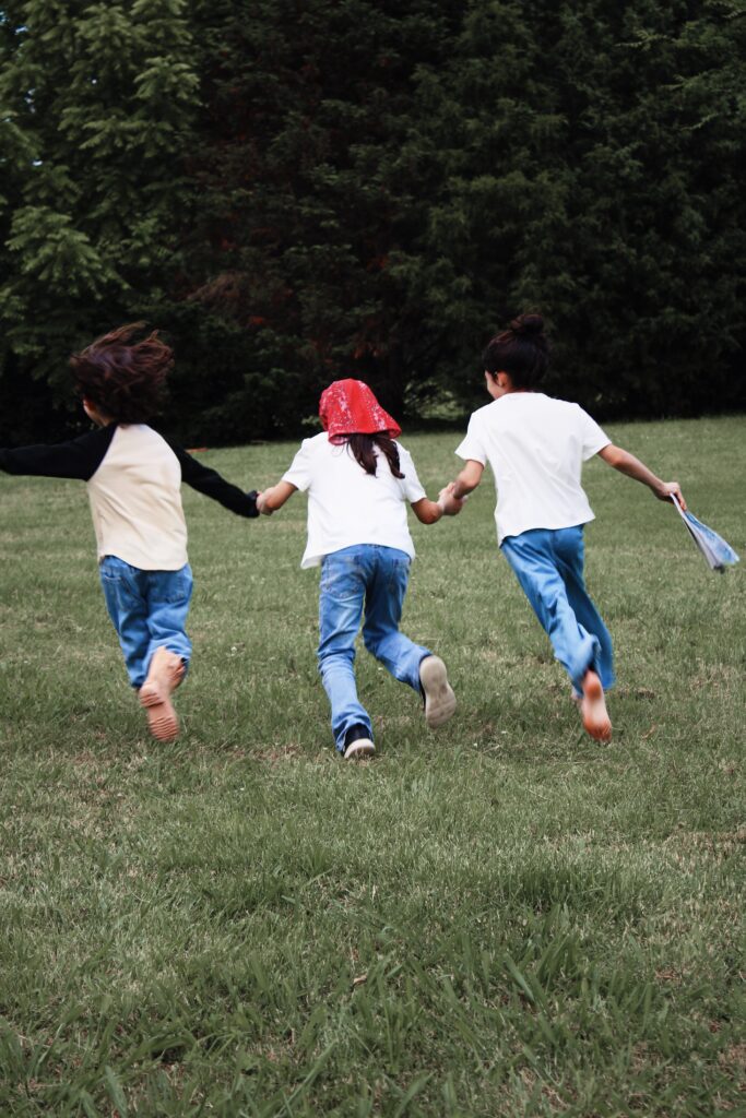 Girls running while holding hands