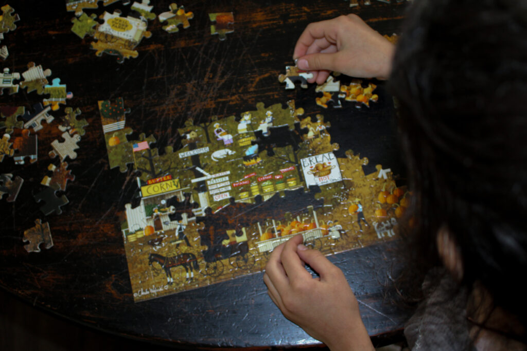 Girl working on a puzzle.