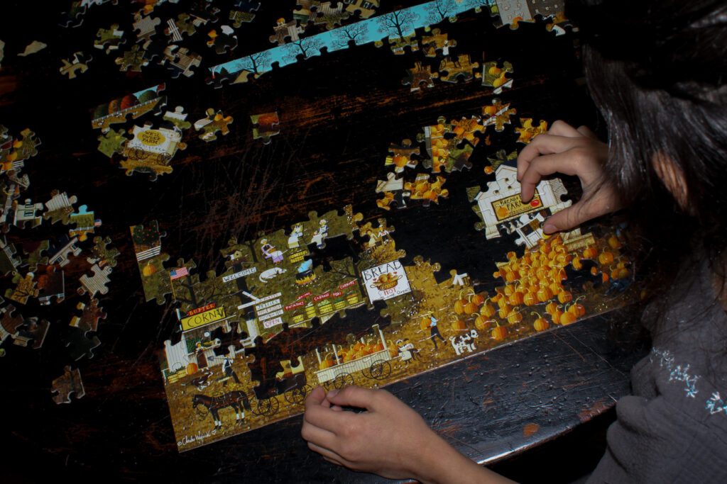 Girl working on a puzzle.