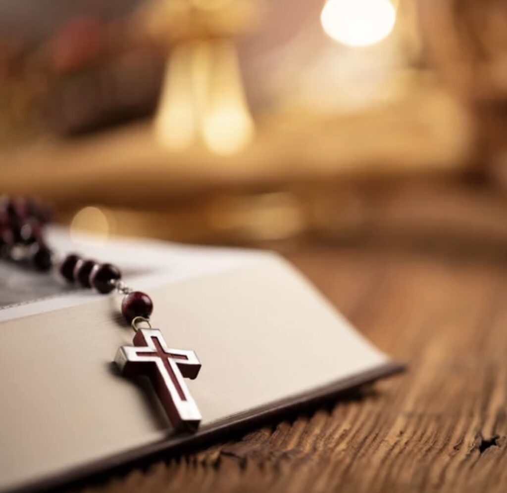 Rosary on a Bible